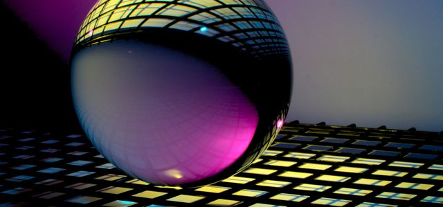 blue and black ball on blue and white checkered textile