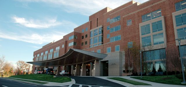 brown concrete building under blue sky during daytime