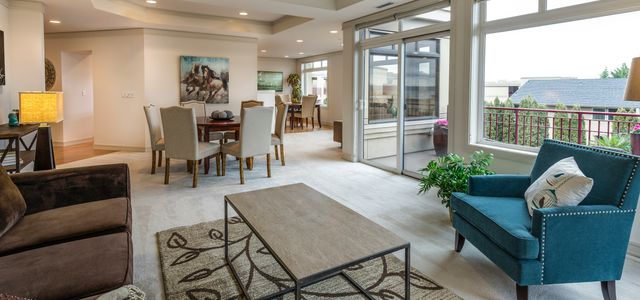 brown wooden coffee table and blue armchair