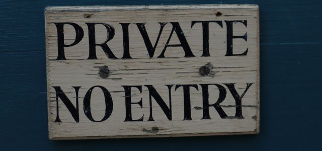 brown wooden welcome to the beach signage