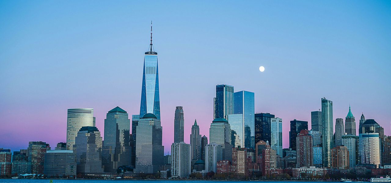 building beside body of water during night time
