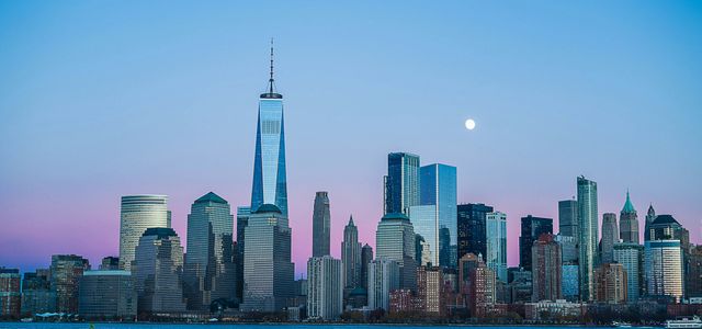 building beside body of water during night time