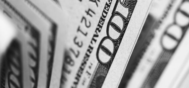 closeup photo of 100 US dollar banknotes