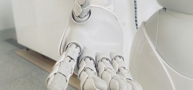 closeup photo of white robot arm