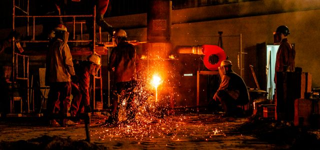 construction men front of fire
