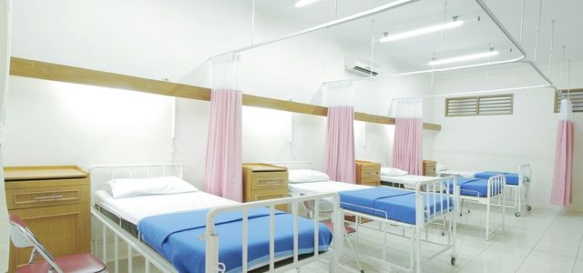 empty hospital bed inside room