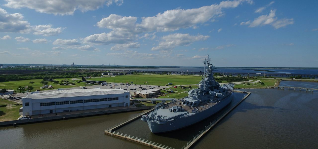 gray ship beside building