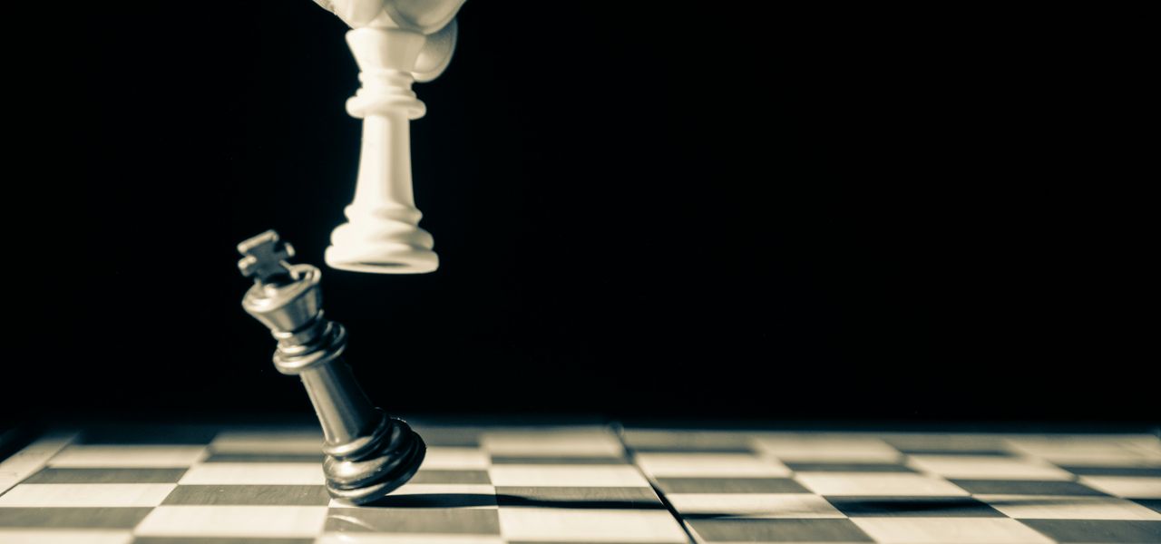 grayscale photo of person holding glass