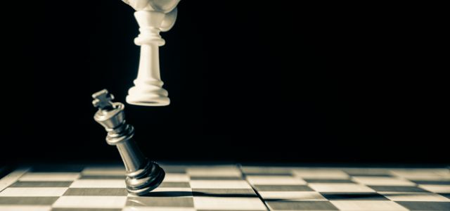 grayscale photo of person holding glass