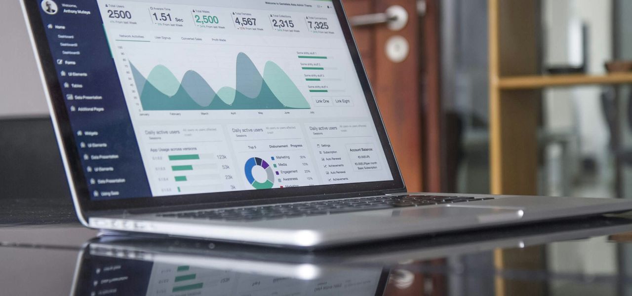 laptop computer on glass-top table