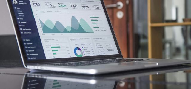 laptop computer on glass-top table