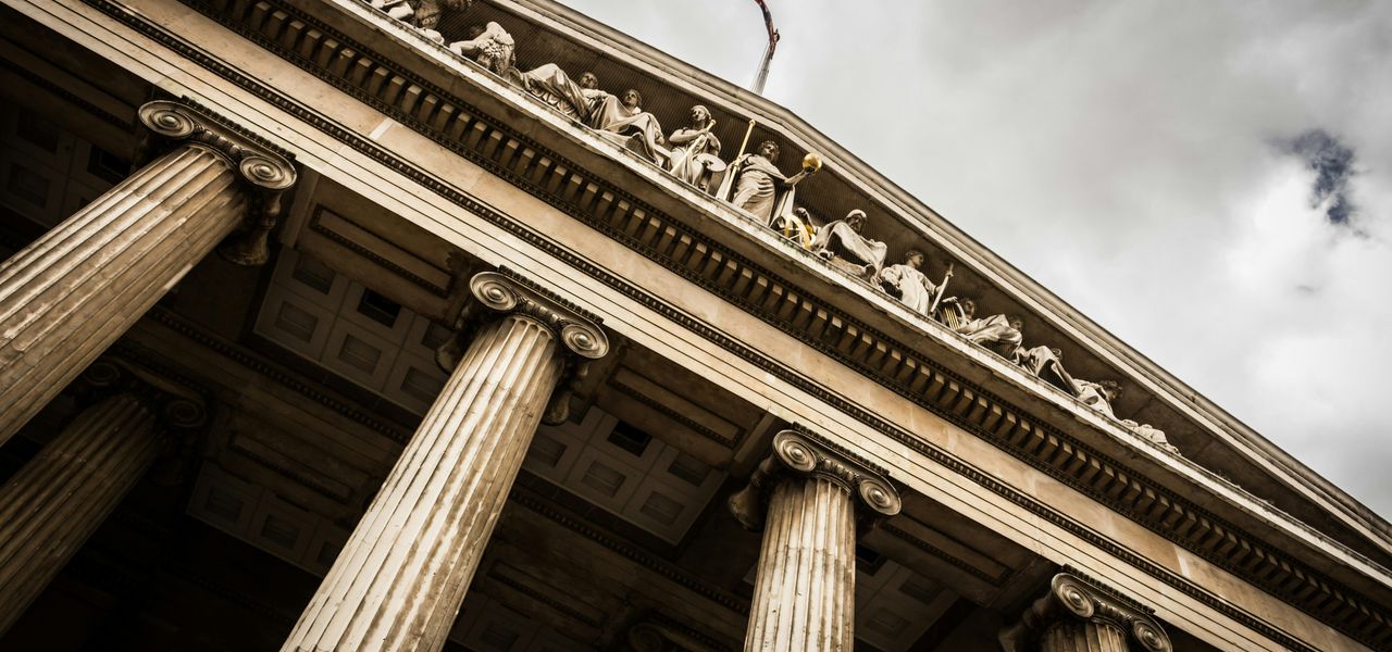low angle photography of beige building