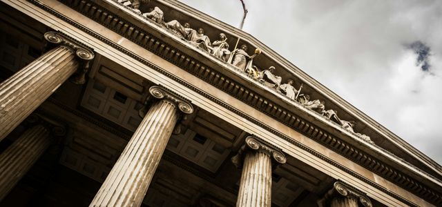 low angle photography of beige building