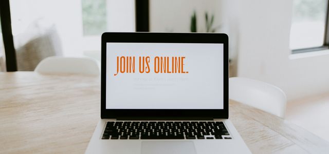 macbook pro on brown wooden table