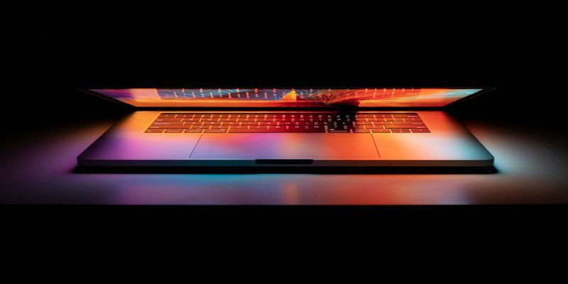 MacBook Pro on white surface