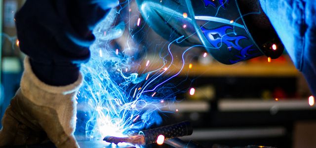 man holding gray steel frame