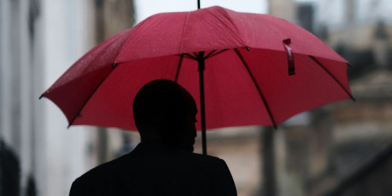 man holding umbrella