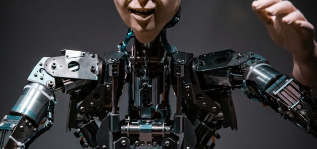 man in black and gray suit action figure