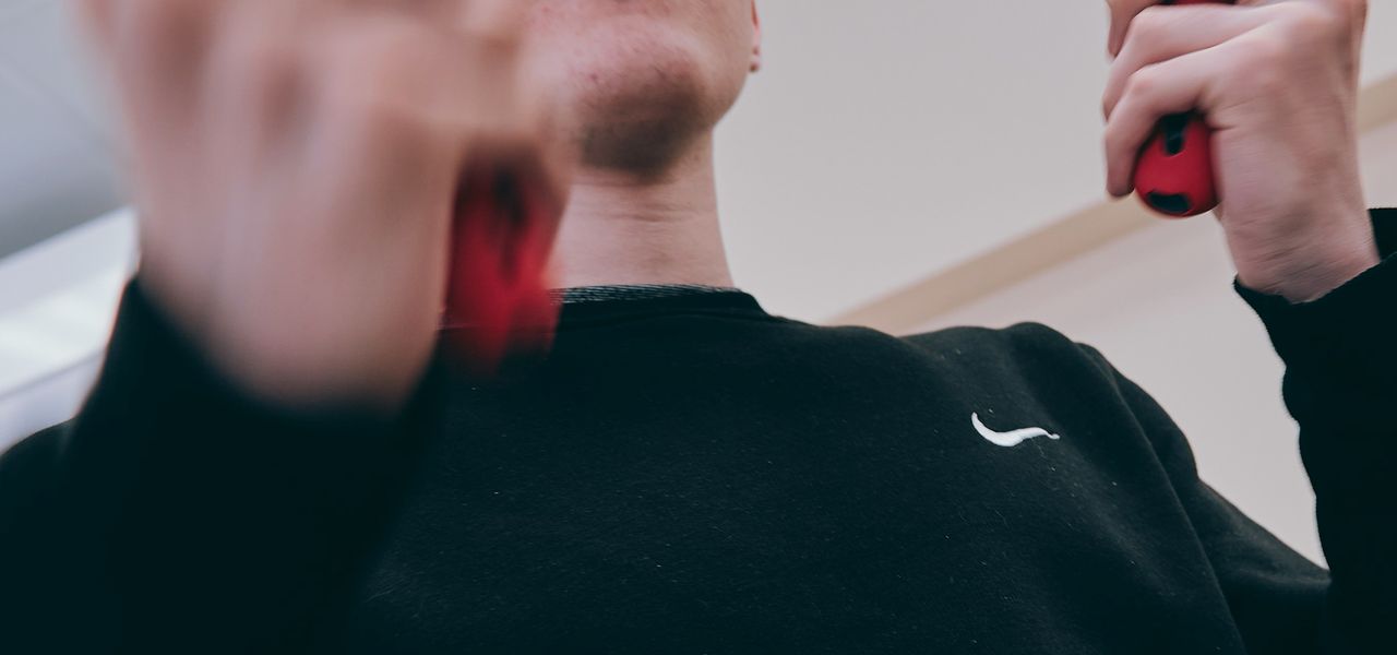 man in black crew neck long sleeve shirt wearing white and black sunglasses