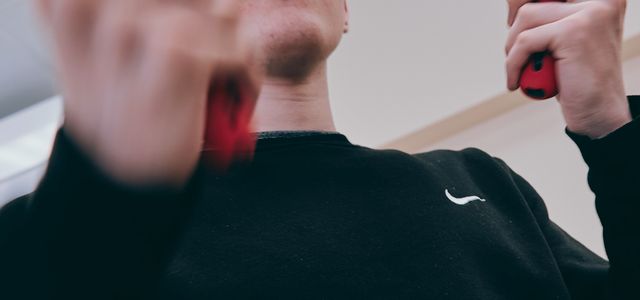 man in black crew neck long sleeve shirt wearing white and black sunglasses