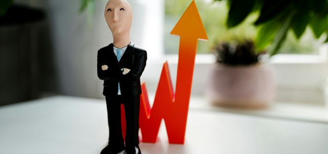 man in black suit jacket and black pants figurine