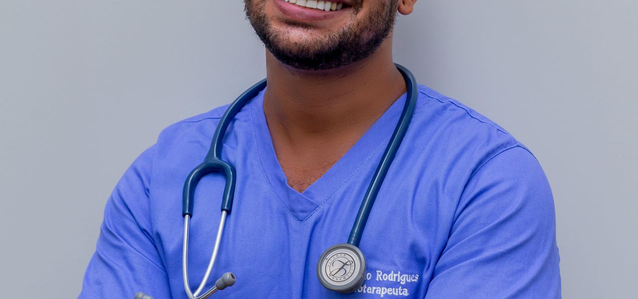 man in blue crew neck t-shirt smiling