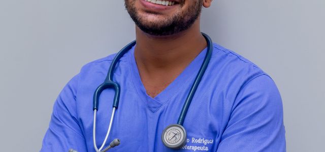 man in blue crew neck t-shirt smiling