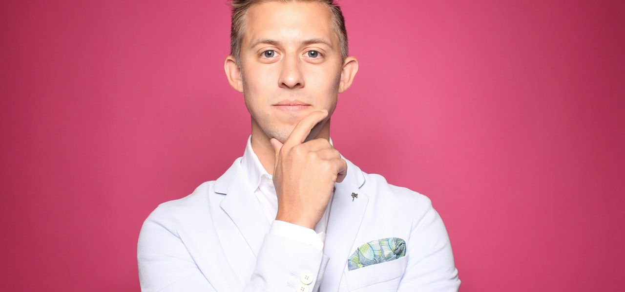 man in white suit jacket