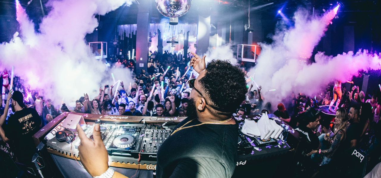 man playing DJ turntable