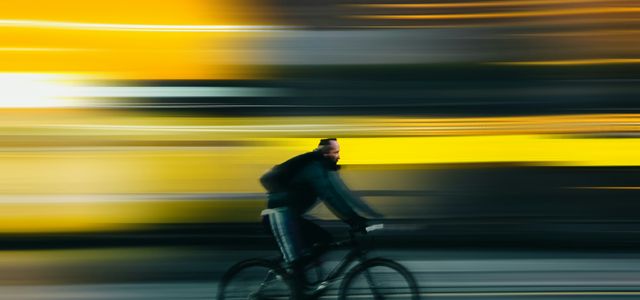 man riding bicycle on road during daytime