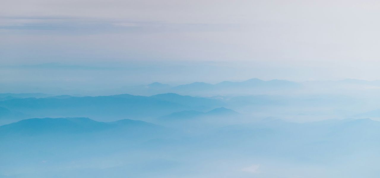 mountain covering with clouds
