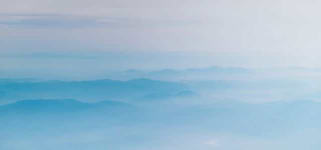 mountain covering with clouds