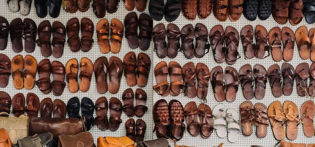 pairs of assorted sandal lot on white textile