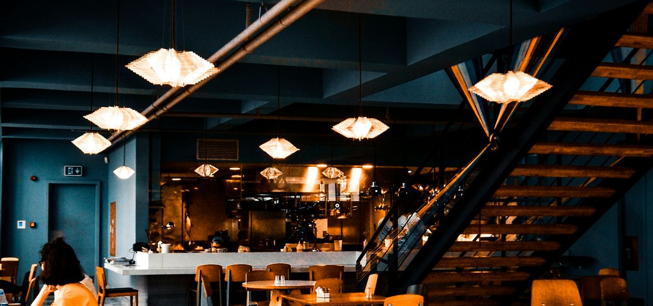 people sitting on chairs inside restaurant