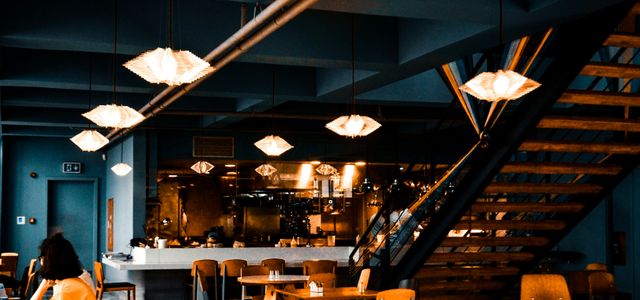 people sitting on chairs inside restaurant