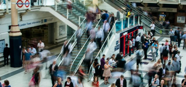 people standing and walking on stairs in mall