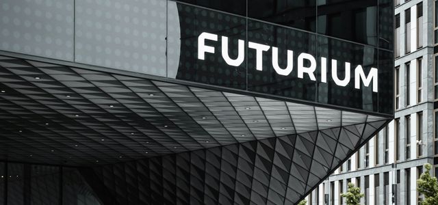 people walking on sidewalk near building during daytime