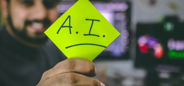 person holding green paper