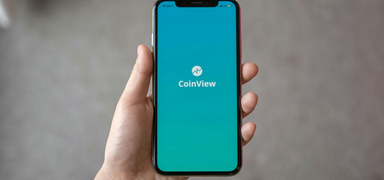 person holding space gray iPhone X