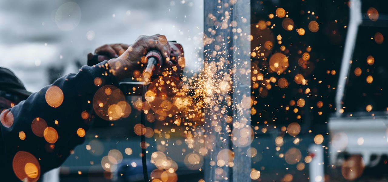 person holding tool during daytime