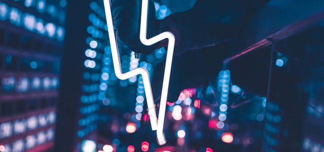 person taking selfie in front of mirror during night time