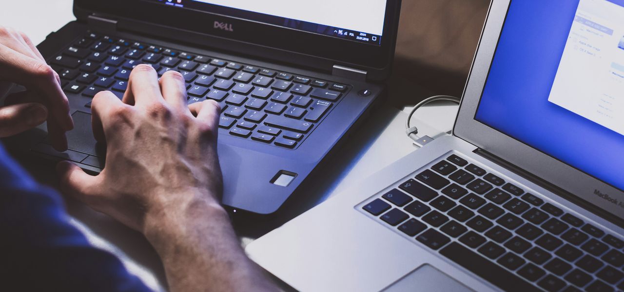 person using black laptop computer