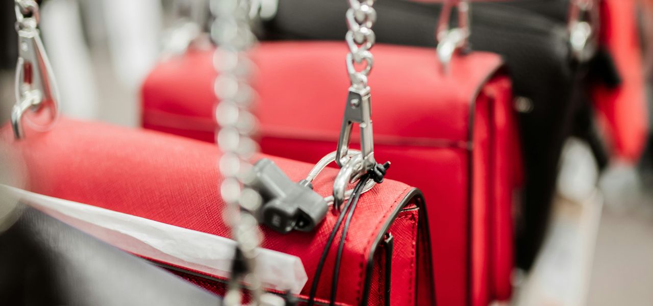 red and silver padlock on gray metal chain