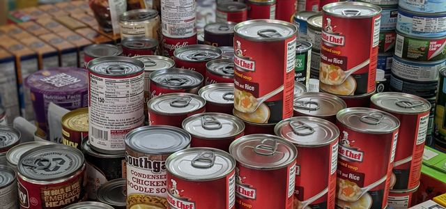 red and white labeled cans