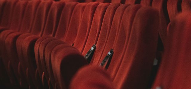 red fabric padded cinema chairs