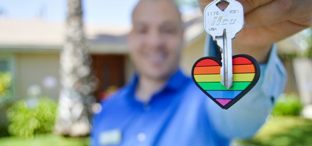 selective photo of gray key with heart key chain