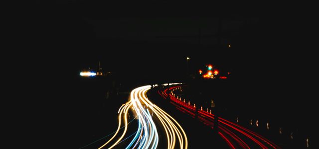 time lapse photography of cars on road during night time
