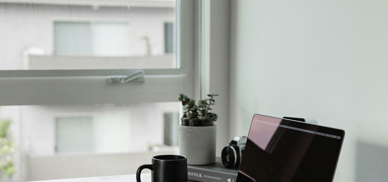 turned off laptop computer with near wall