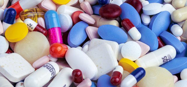 white blue and orange medication pill