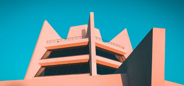 white concrete building under blue sky during daytime